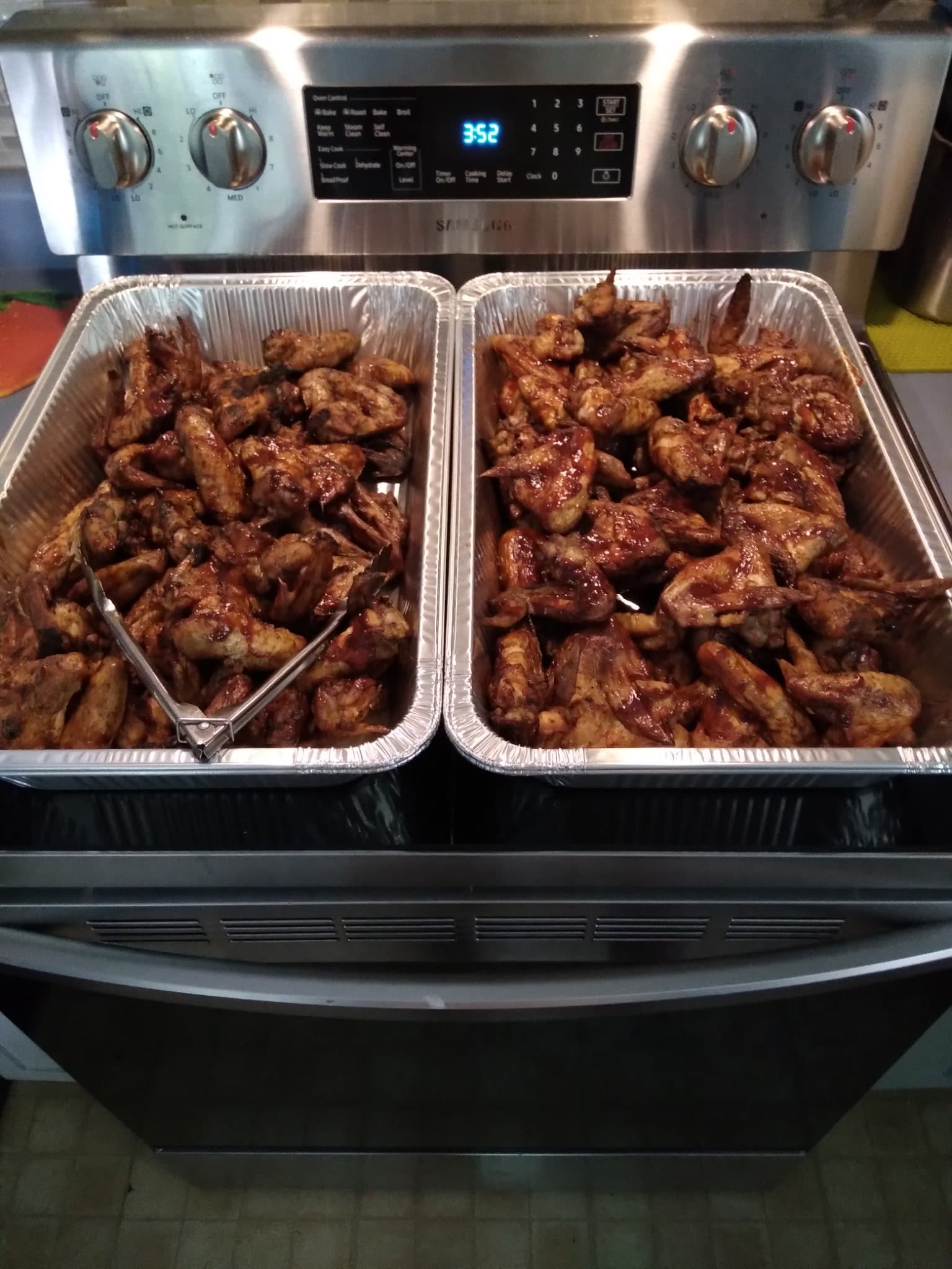 Catering trays of smoked wings fresh off the stove
